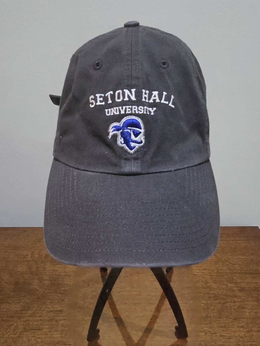 Seton Hall University adjustable baseball cap with white text and blue logo